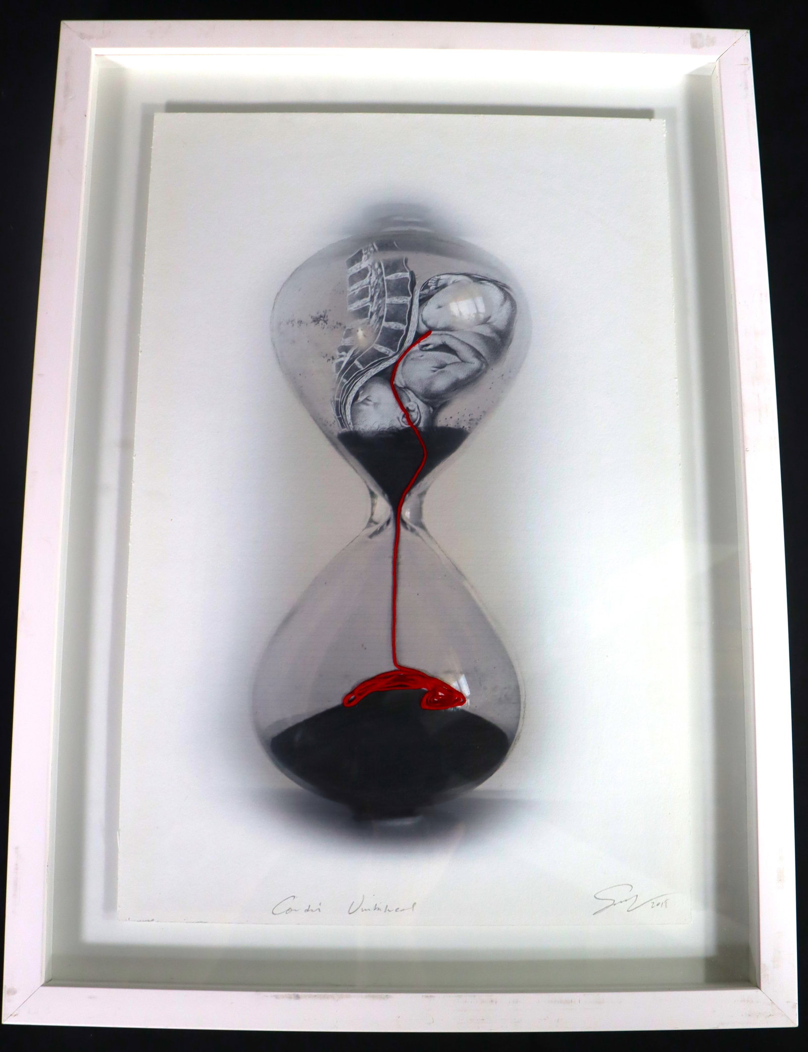 Framed Mixed Media on paper signed and dated 2019: Framed Mixed Media on paper signed and dated 2019, Baby with umbilical cord in hourglass painting" DIMENSIONS with frame: Height 22.80 inch / 58 cm 