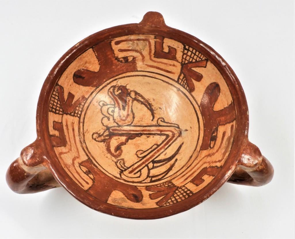 Pre-Columbian Pottery Tripod Bowl, Costa Rica.: Pre-Columbian Pottery Tripod Bowl, Costa Rica. Circa 1350. Cream colored bowl with orange and brown paint, the legs represent stylized animal heads, and the rest of the decoration are related to 