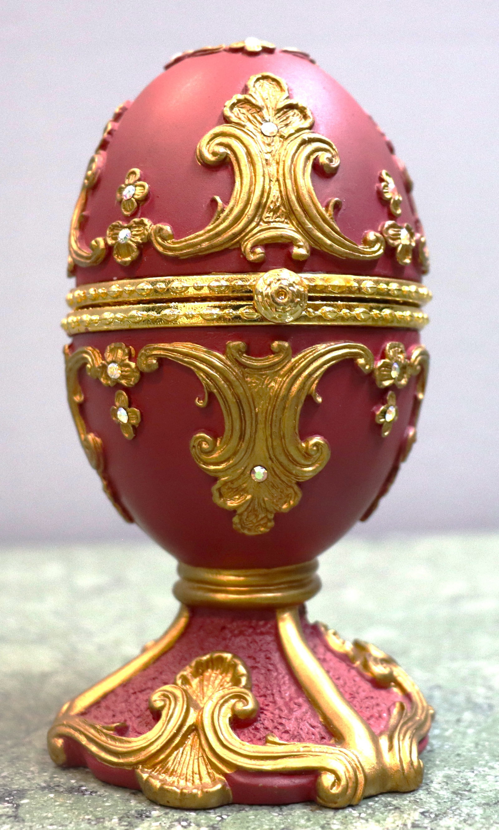 Vintage Sankyo red Fabergé egg-style musical jewelry box featuring intricate gold scrollwork and (1 of 7)