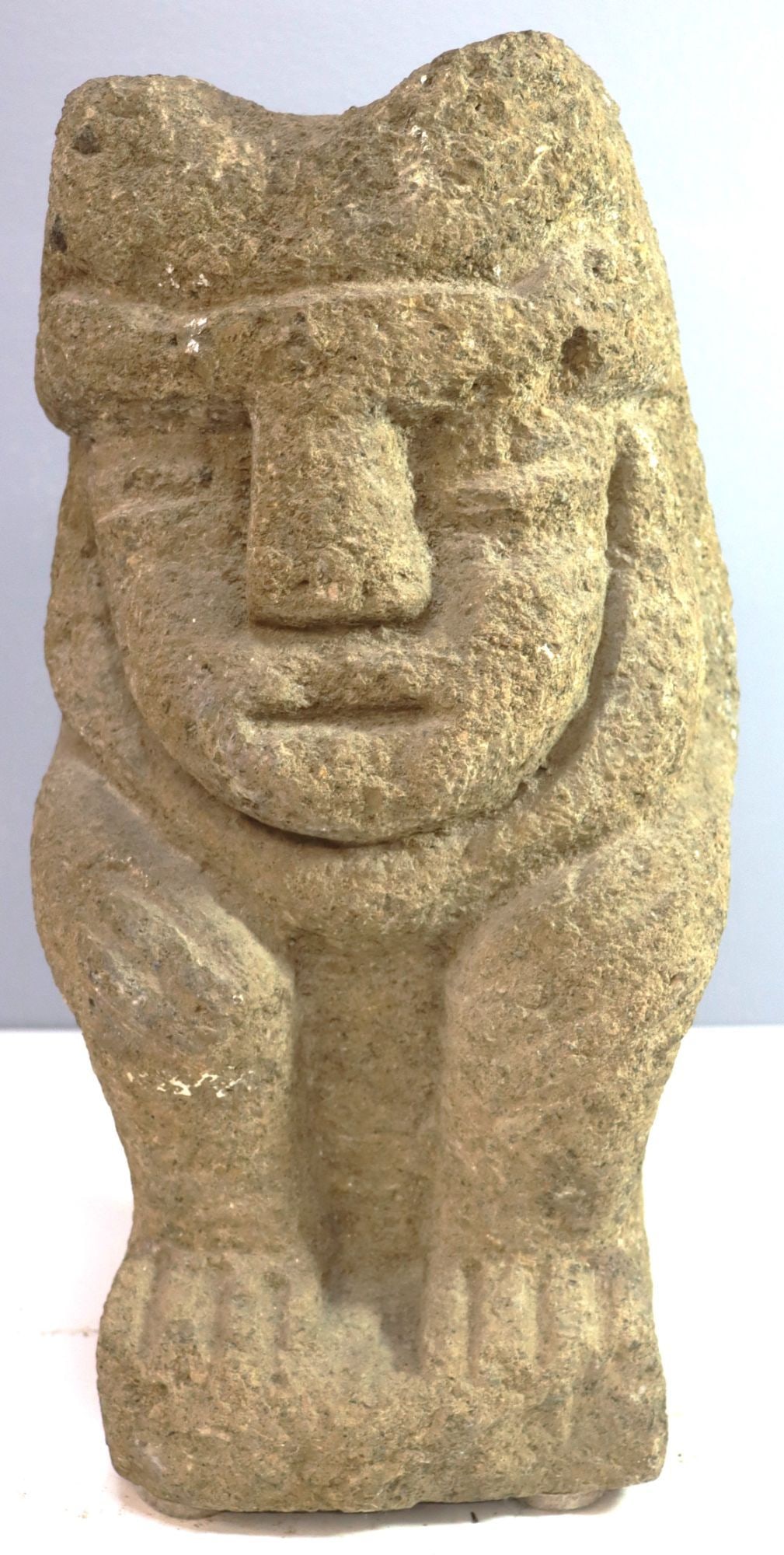 Pre-Columbian Style Stone Figure Sculpture Indige: This is a substantial stone sculpture crafted in the style of Pre-Columbian indigenous art, depicting a seated figure with distinct facial features and stylized limbs. The figure exhibits characterist