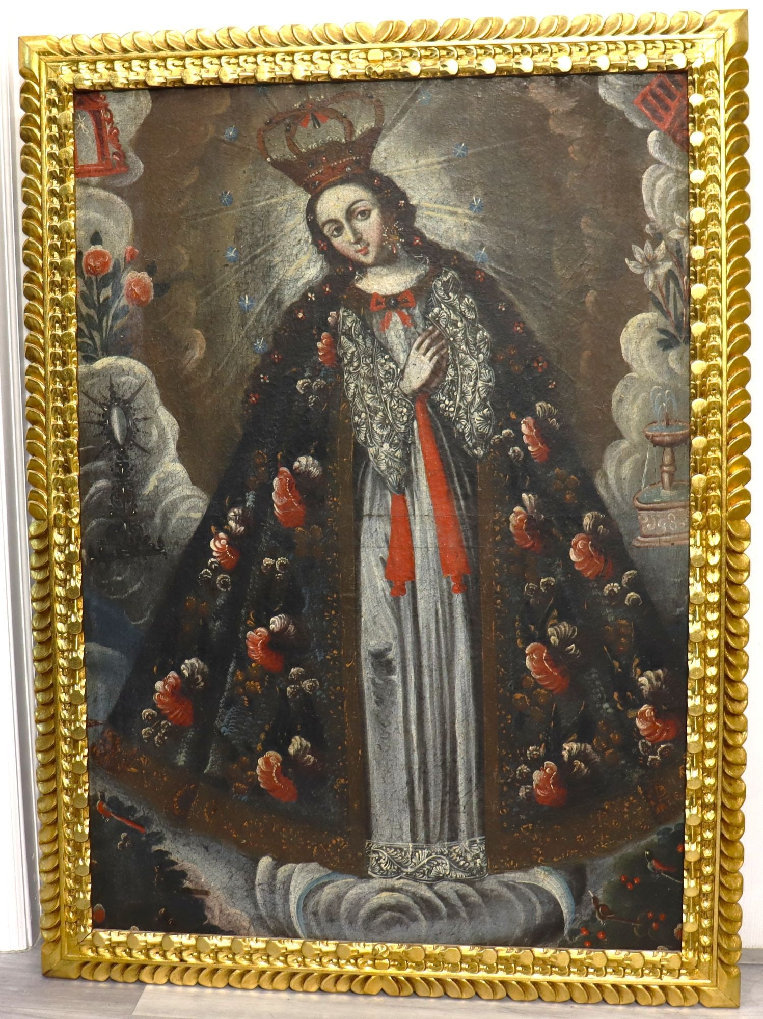Cuzco School INMACULADA CONCEPCIÓN Antique Oil on: Religious painting depicting Spanish Colonial painting, characteristic of the Cuzco School tradition from Peru figure in a richly patterned dark floral mantle, pale robe, red ribbons, and elaborate wh