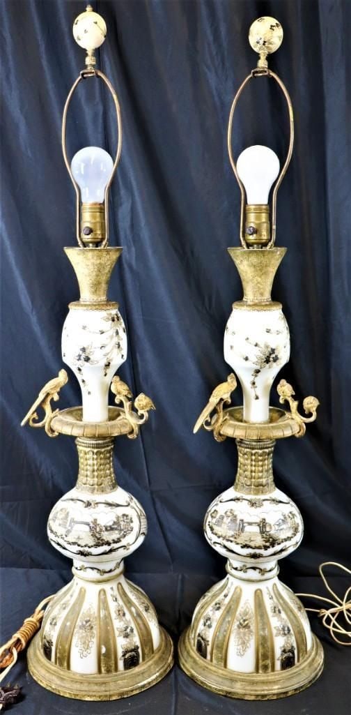Pair of Porcelain Table Lamps with Gilt Brass Bir: This is a distinguished pair of table lamps, crafted from porcelain and adorned with intricate gilt brass elements. Each lamp features a baluster-form body with a tapered base, decorated with detailed
