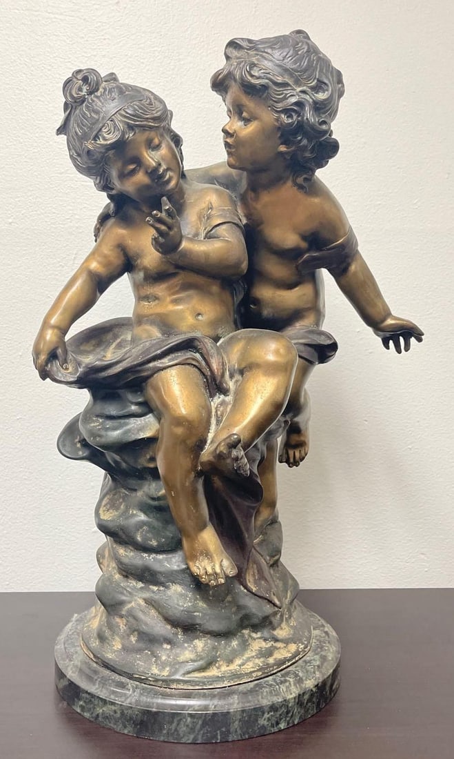 Auguste Moreau Bronze Patinated Figural Sculpture: This exquisite figural sculpture, titled "Two Cherubs," is a notable work by the renowned French artist Auguste Moreau, dated 1890. The piece depicts two putti, or cherubs, in an affectionate embrace,