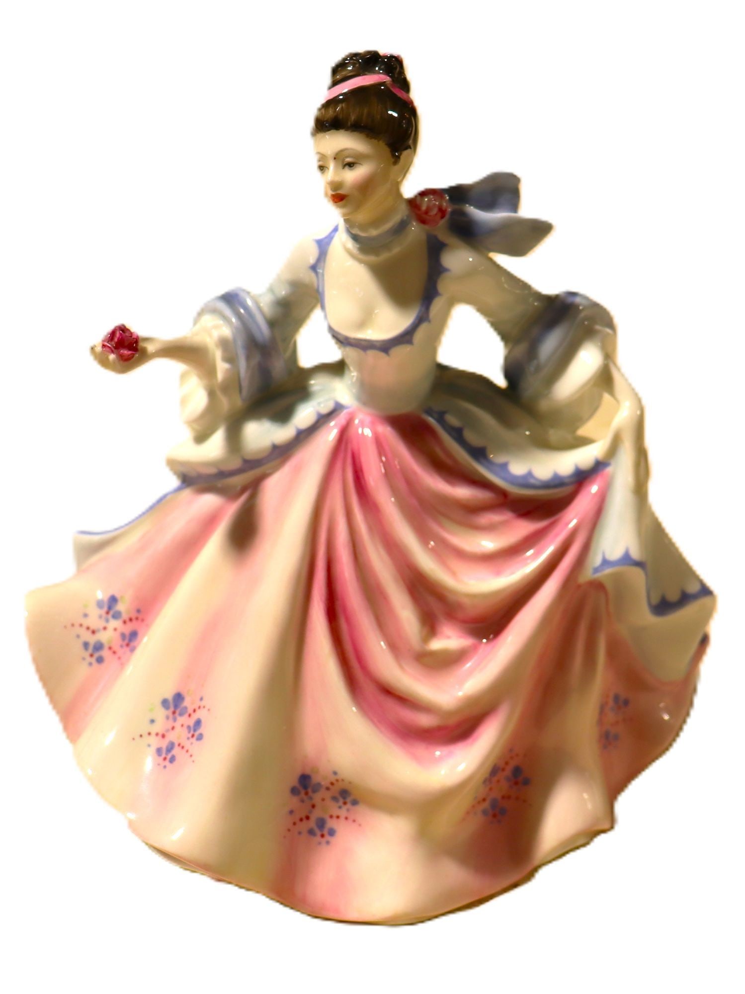 Royal Doulton "Rebecca" HN 2805 Porcelain Figurin: This exquisite Royal Doulton porcelain figurine, titled "Rebecca" and bearing the model number HN 2805, depicts a finely dressed woman in a flowing pink and white gown with blue accents and floral det