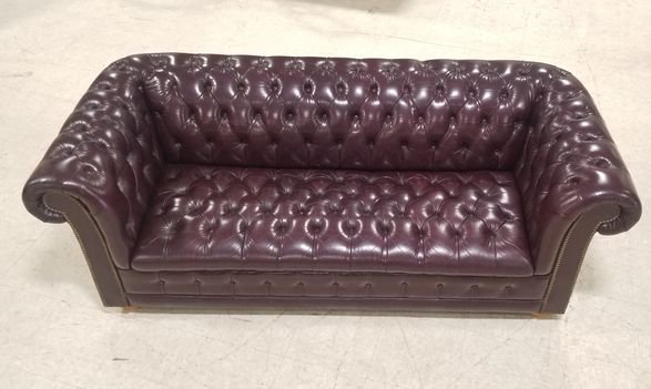 Tufted leather sofa: Flawless. Burgundy red leather . measures 74" long 28" high 20" deep.