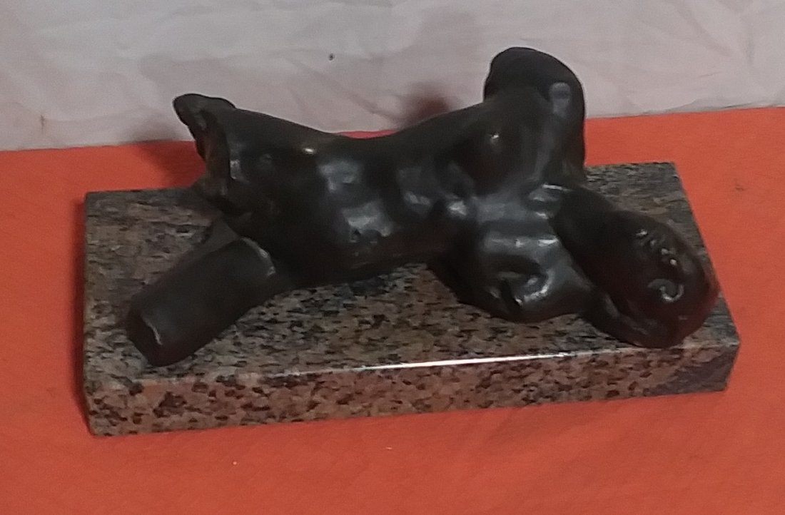 Bronze statue of nude on marble base August Rodin: This is a bronze statue of a nude on a marble base. It is attributed to August Rodin. The figure measures 13 in long while they marble base measures 13 in long and 5 and 1/2 in wide.