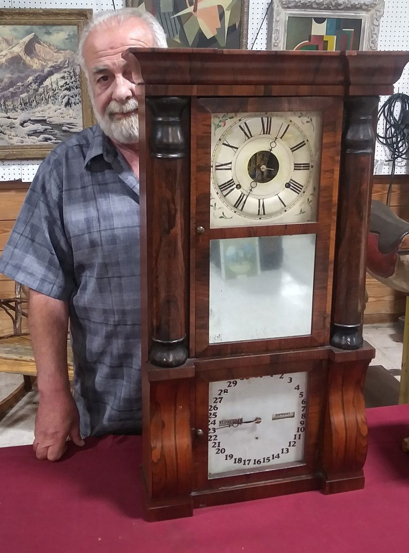 Seth Thomas 8-day double dial clock: Seth Thomas weight driven double dial Empire clock measuring 32 and 1/2 in wide by 16 in wide