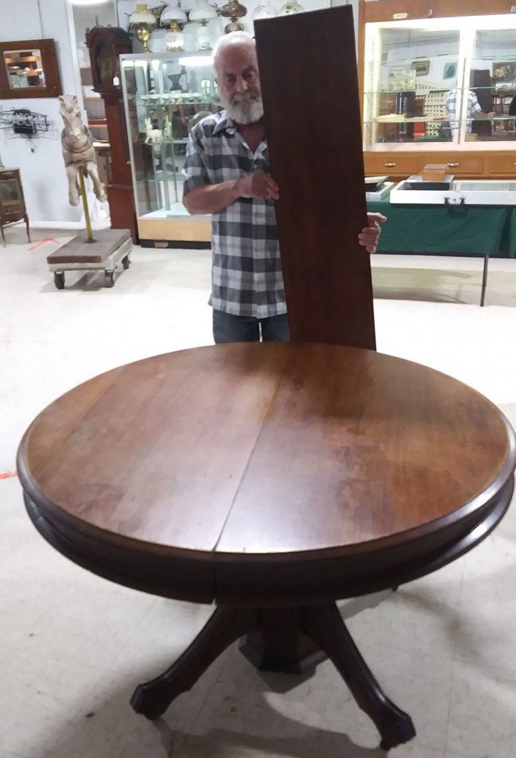High style, walnut split pedestal dining table: Measures 45" round including 4 leaves house ready