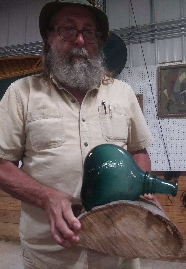 Pirate Era Rum Bottle: Pirate era rum bottle blob top and broken Pinal blown glass 9 and 1/2 in high 7 and 1/2 in wide