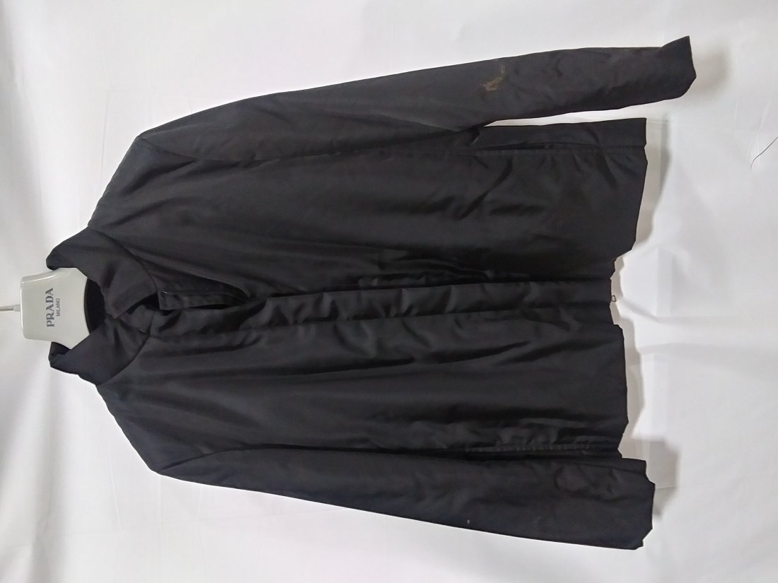 Black PRADA Zip up jacket stain on sleeve size unknown: Black PRADA Zip up jacket stain on sleeve size unknown