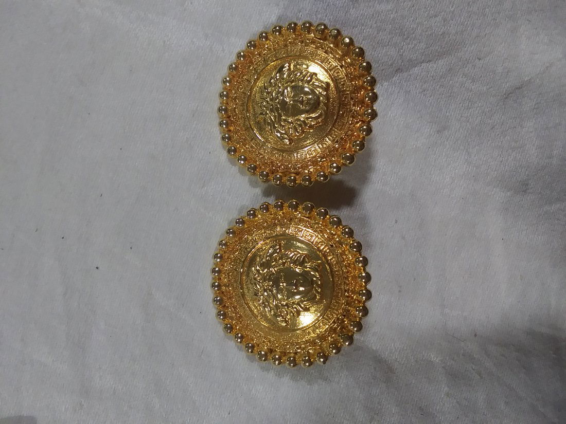 Large Versace Gold tone clip-on earrings: Large Versace Gold tone clip-on earrings