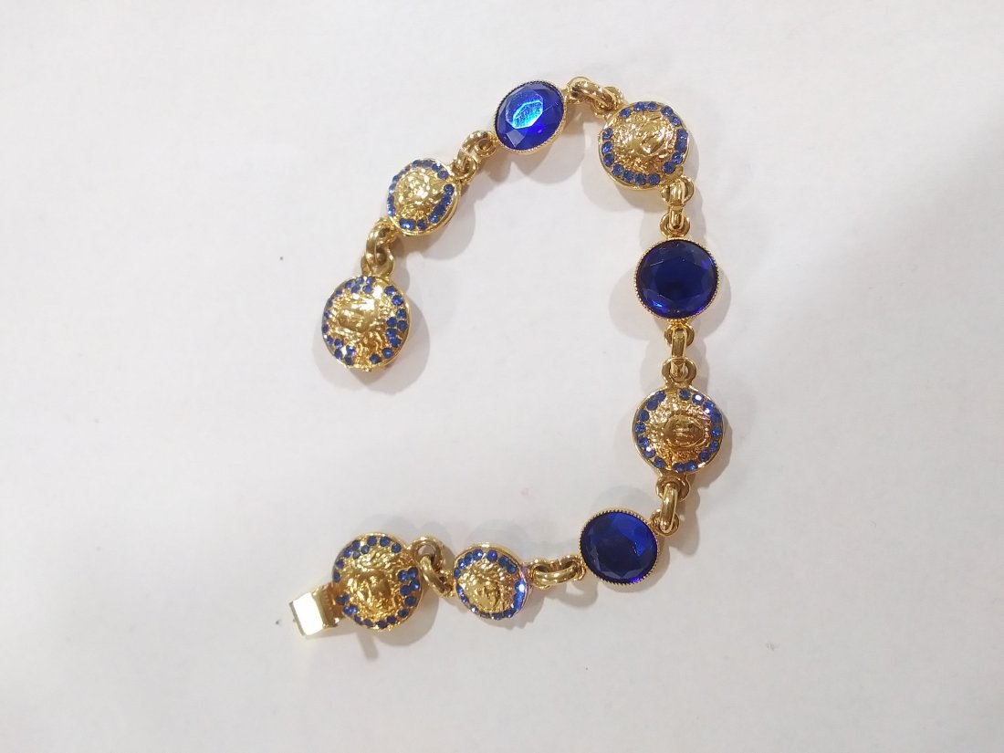 Versace gold tone Bracelet with blue embellishments: Versace gold tone Bracelet with blue embellishments
