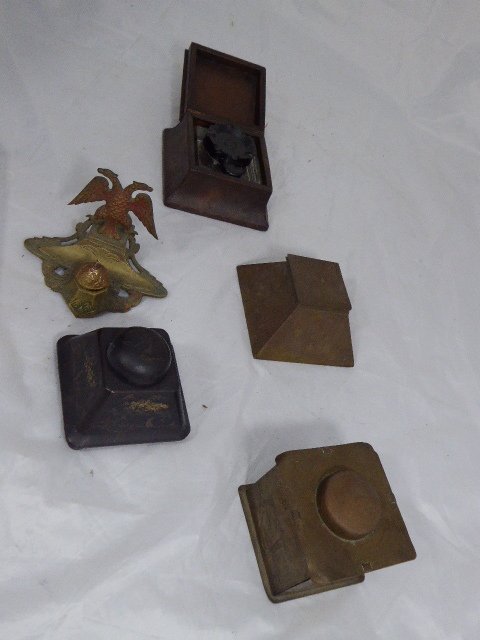 A collection of inkwells to including an Arts and: A collection of inkwells to including an Arts and Crafts Apollo Studios New York example, a papier mache example and a leatherbound example etc.