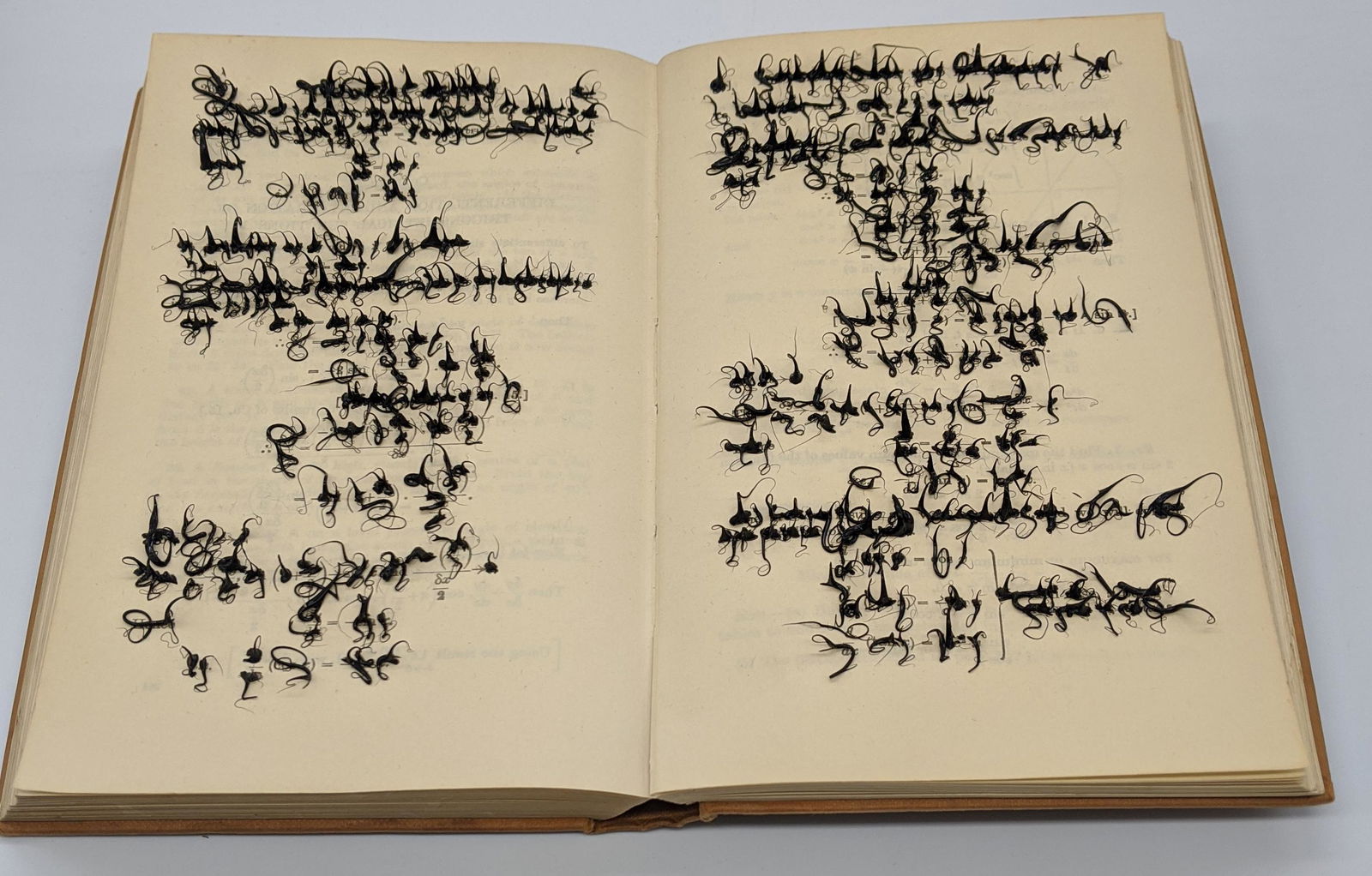 Jonathan Callan (British, b.1961), Elementary Analysis,: Jonathan Callan (British, b.1961), Elementary Analysis, 1998, book with silicone, H.19cm W.25.5cm