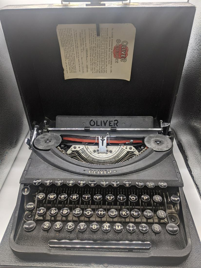 An Oliver portable typewriter, retailed by Harrods,: An Oliver portable typewriter, retailed by Harrods, 1954