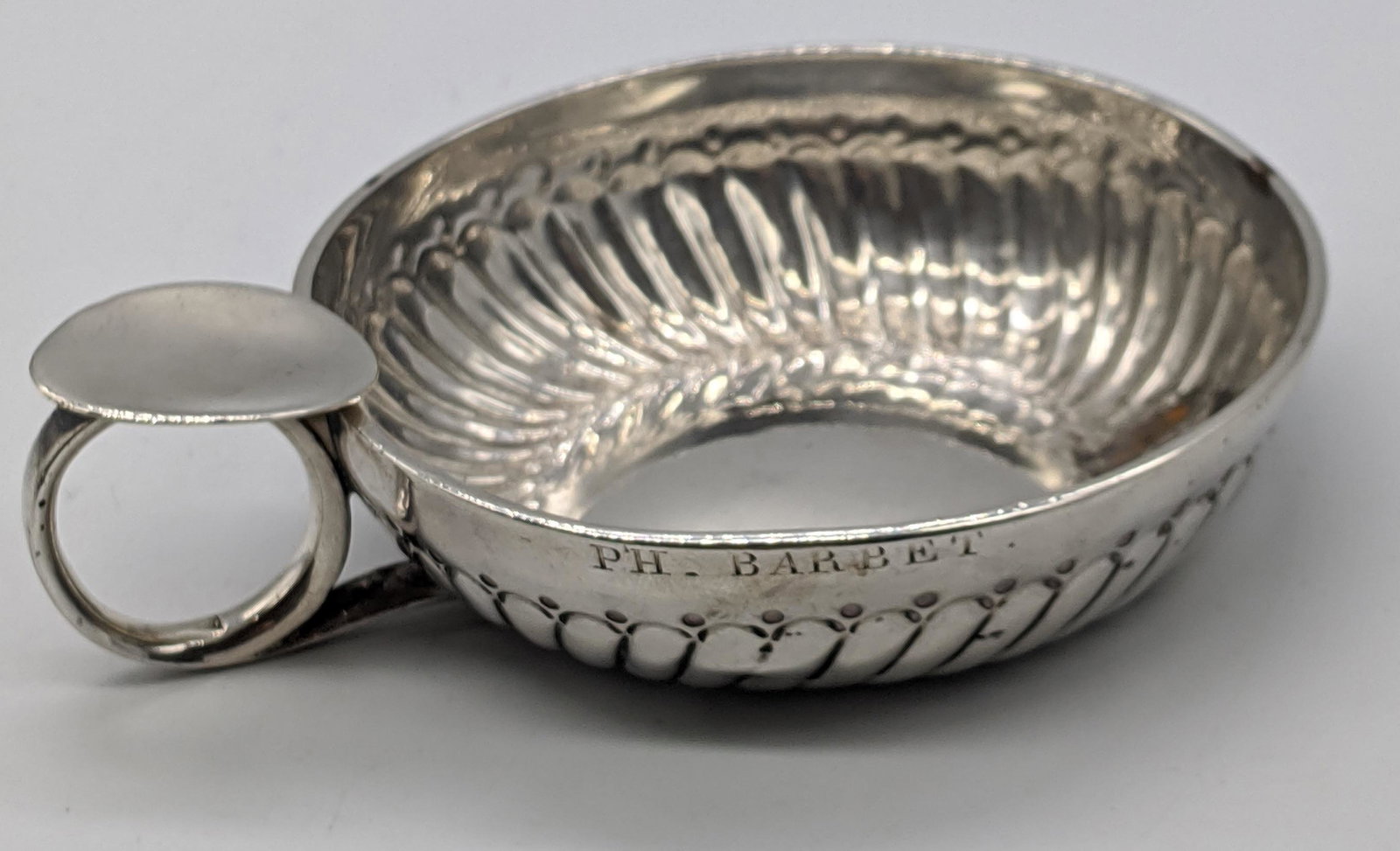 A French silver wine taster,marked to handle and case,: A French silver wine taster,marked to handle and case, engraved PH.BARBET, 73g, D.10cm