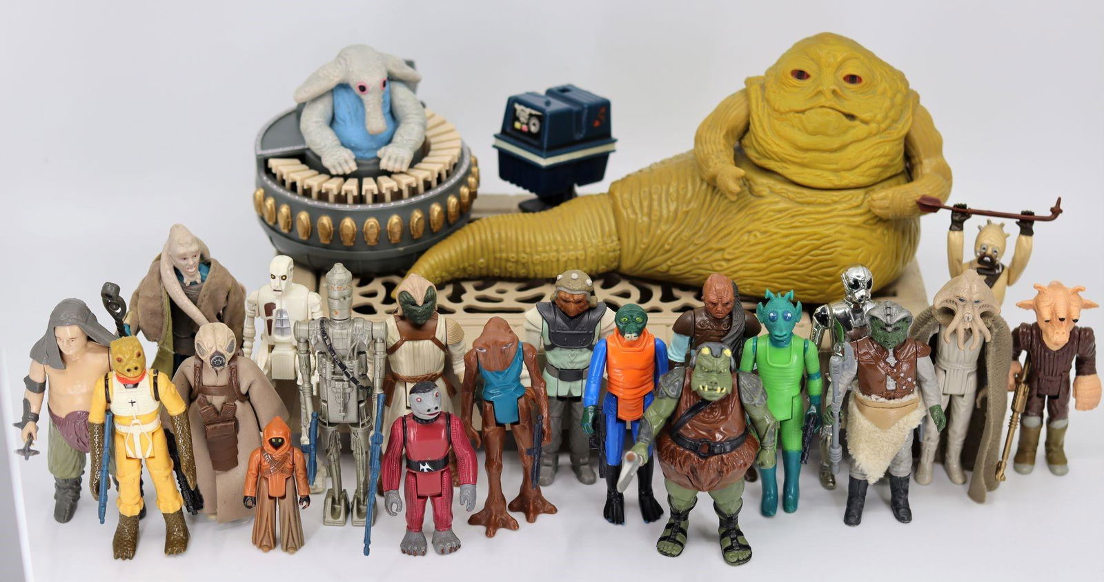 A Collection of 23 Star Wars Figures, Kenner, 1977,: A Collection of 23 Star Wars Figures, Kenner, 1977, 1978, 1980, 1981, 1983, 1984, Hong Kong: Jabba The Hutt, Max Rebo, Snaggletooth, Bib Fortuna, Rancor Keeper, Squid Head (Tessek), Walrus Man (Ponda