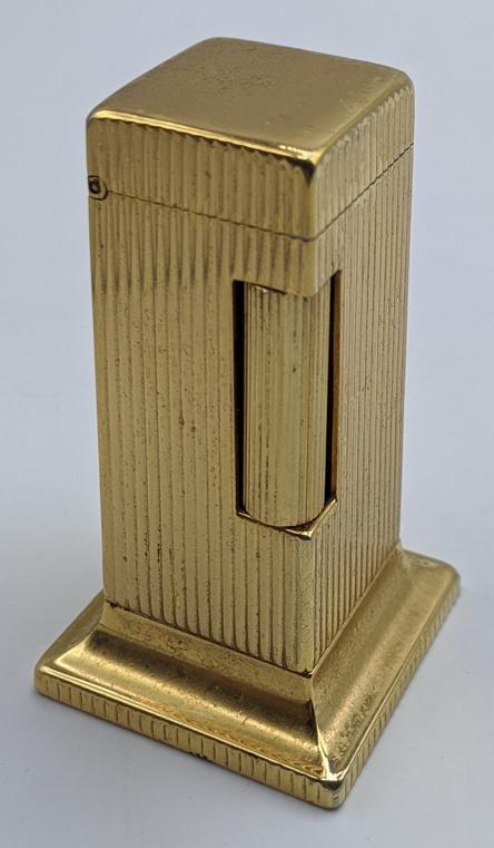 A Dunhill Rollalite gold plated desk lighter, H.6.5cm: A Dunhill Rollalite gold plated desk lighter, H.6.5cm