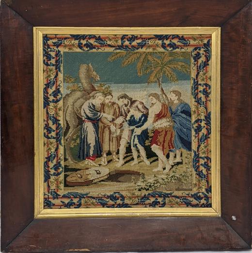 A 19th century Jewish embroidered scene of Daniel: A 19th century Jewish embroidered scene of Daniel thrown into the den of lions,, 49cm x 43cm