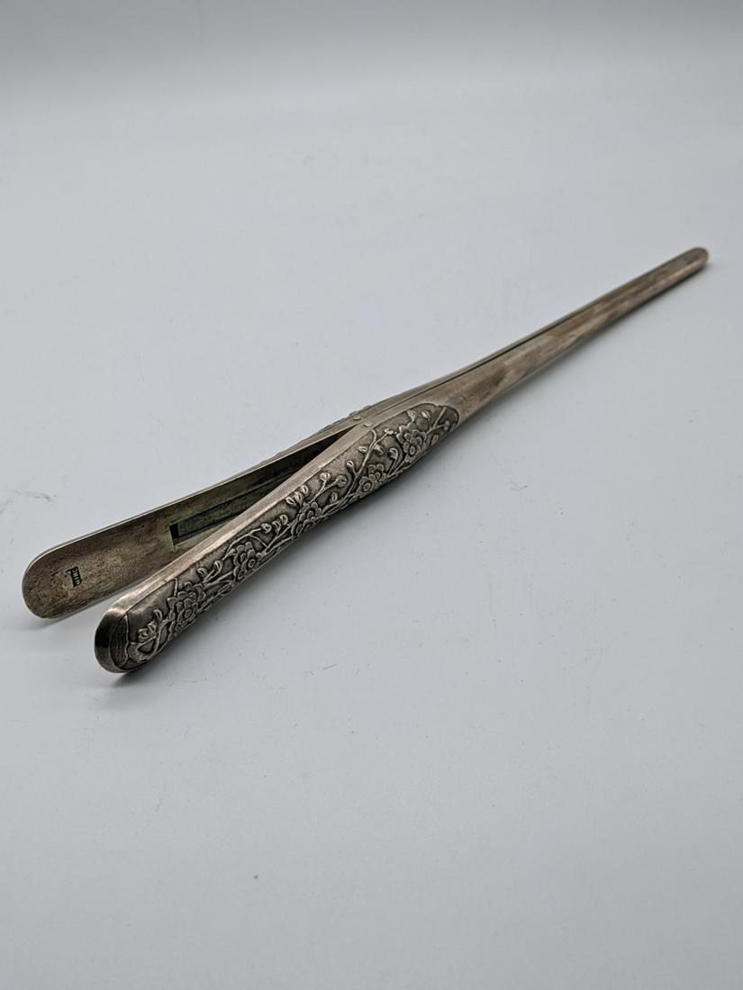 A pair of late 19th century Chinese export silver glove: A pair of late 19th century Chinese export silver glove stretchers by Wang Hing of Hong Kong, etched decoration of lotus, marked to inside edge, initialled, 122g, L.23cm