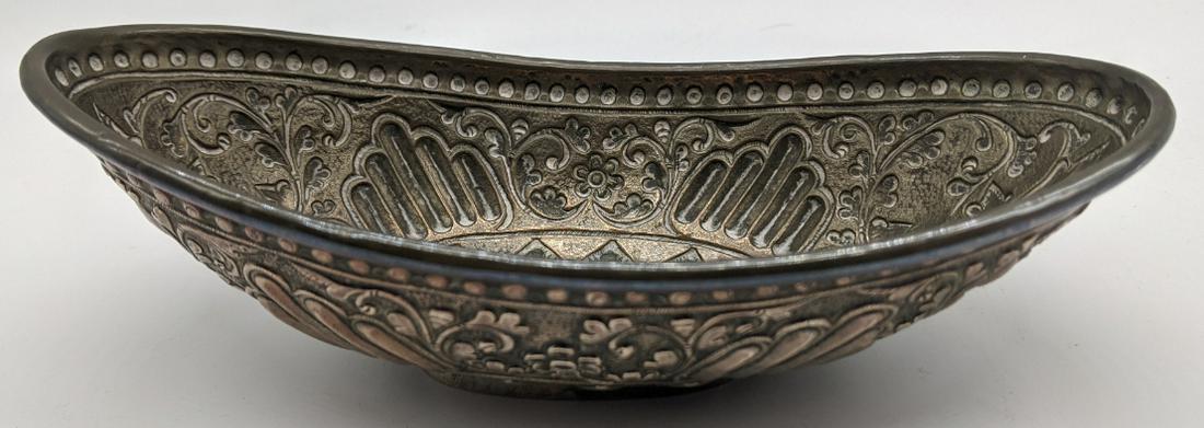 A 19th century Balinese offering dish, repousse: A 19th century Balinese offering dish, repousse embossed, Indonesia, 80.5g L.18cm