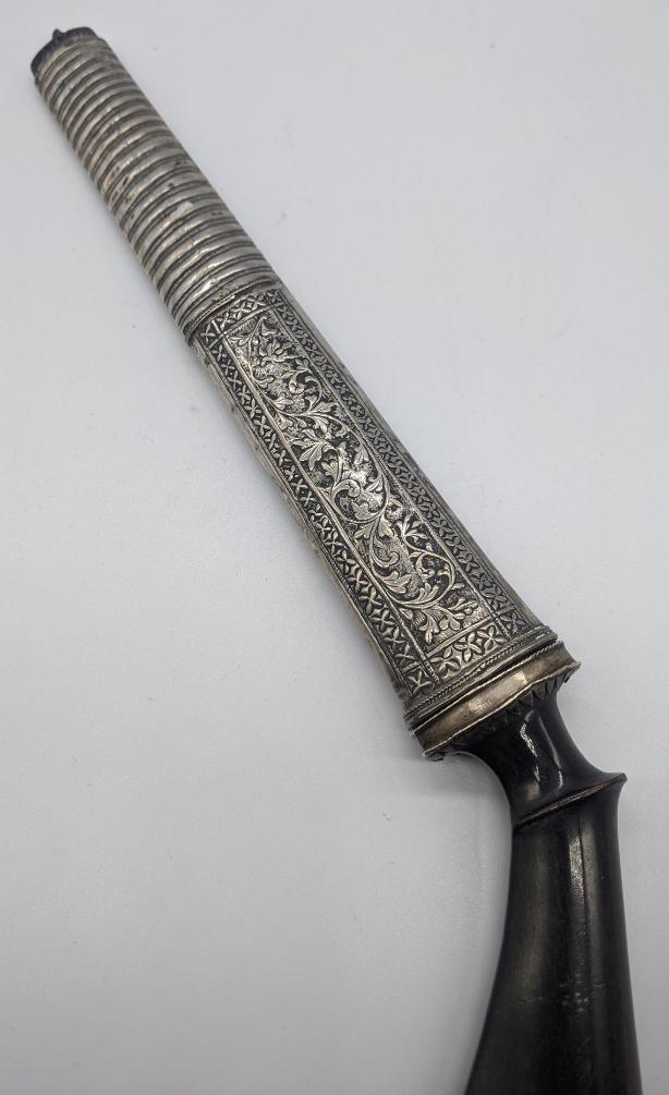 A 19th century Indonesian or Malaysian dagger (Badek),: A 19th century Indonesian or Malaysian dagger (Badek), engraved silver mounts and carved horn hilt, Indonesia or Malaysia, L. 30cm