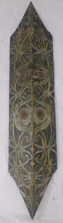 Tribal Art Dayak wooden shield decorated with a demon: Tribal Art Dayak wooden shield decorated with a demon face, Borneo, H.97cm W.20cm