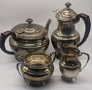 A silver tea set comprising of a teapot, waterpot, milk