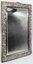 A large Edwardian silver table mirror, vacant