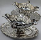 A pair of 19th century French silver sauceboats on trays, marks to edge, 1390g, L.25.5cm