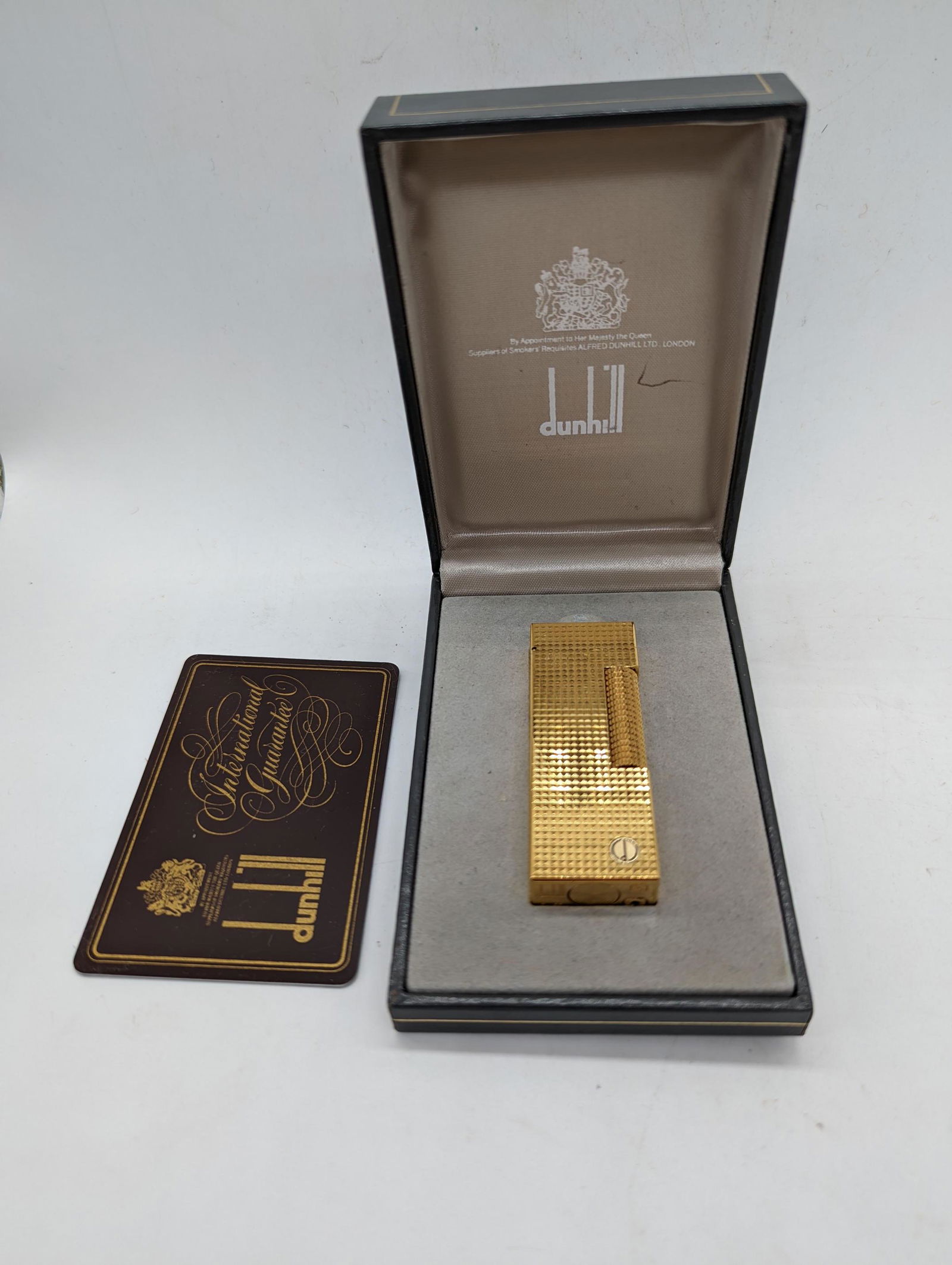 A Dunhill gold plated lighter with case: A Dunhill gold plated lighter with case