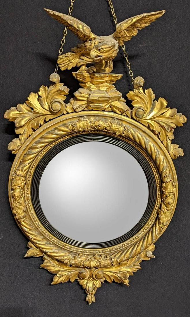 A Regency giltwood convex wall mirror, eagle finial, H.102cm: A Regency giltwood convex wall mirror, eagle finial, H.102cm