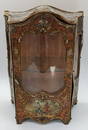 A miniature Louis XVI style vitrine, metal outer depicting scenes of musicians, instruments and