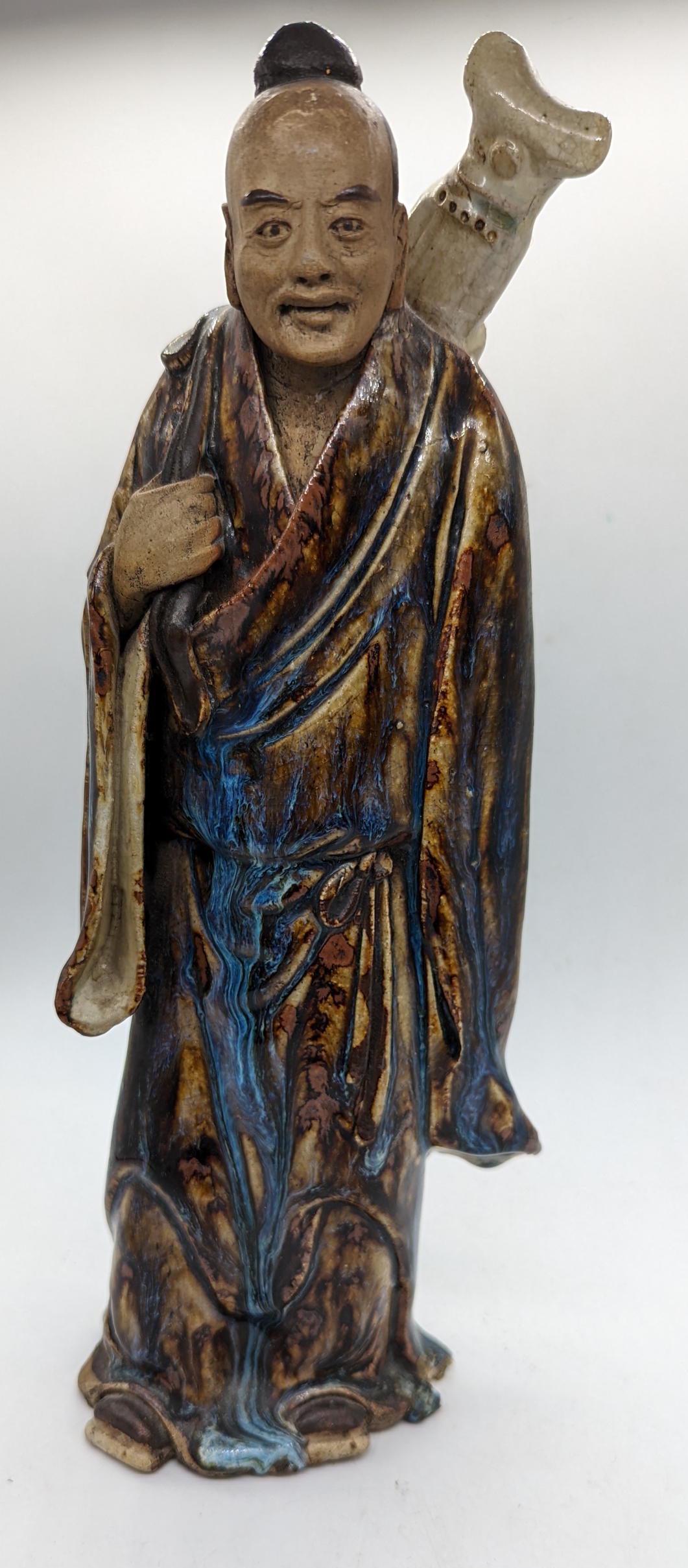 A 19th century Chinese high fire clay figure, H.32cm: A 19th century Chinese high fire clay figure, H.32cm