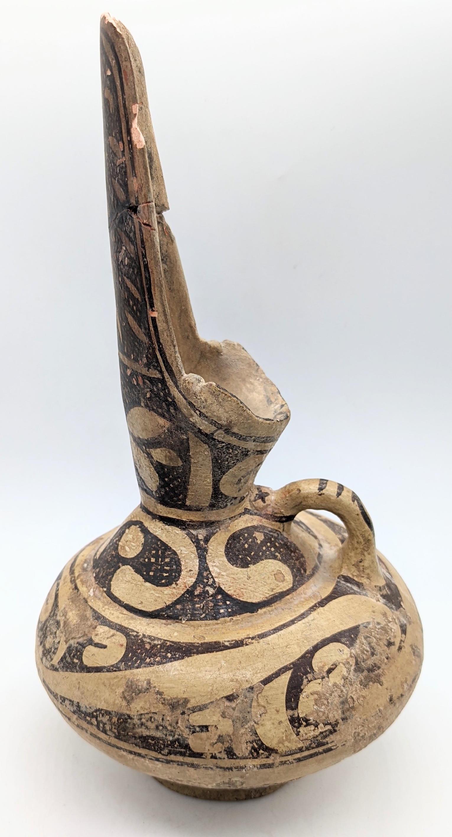 A 10th century glazed pottery ewer, monochrome decor, Iran or Central Asia, H.29cm (1 of 3)
