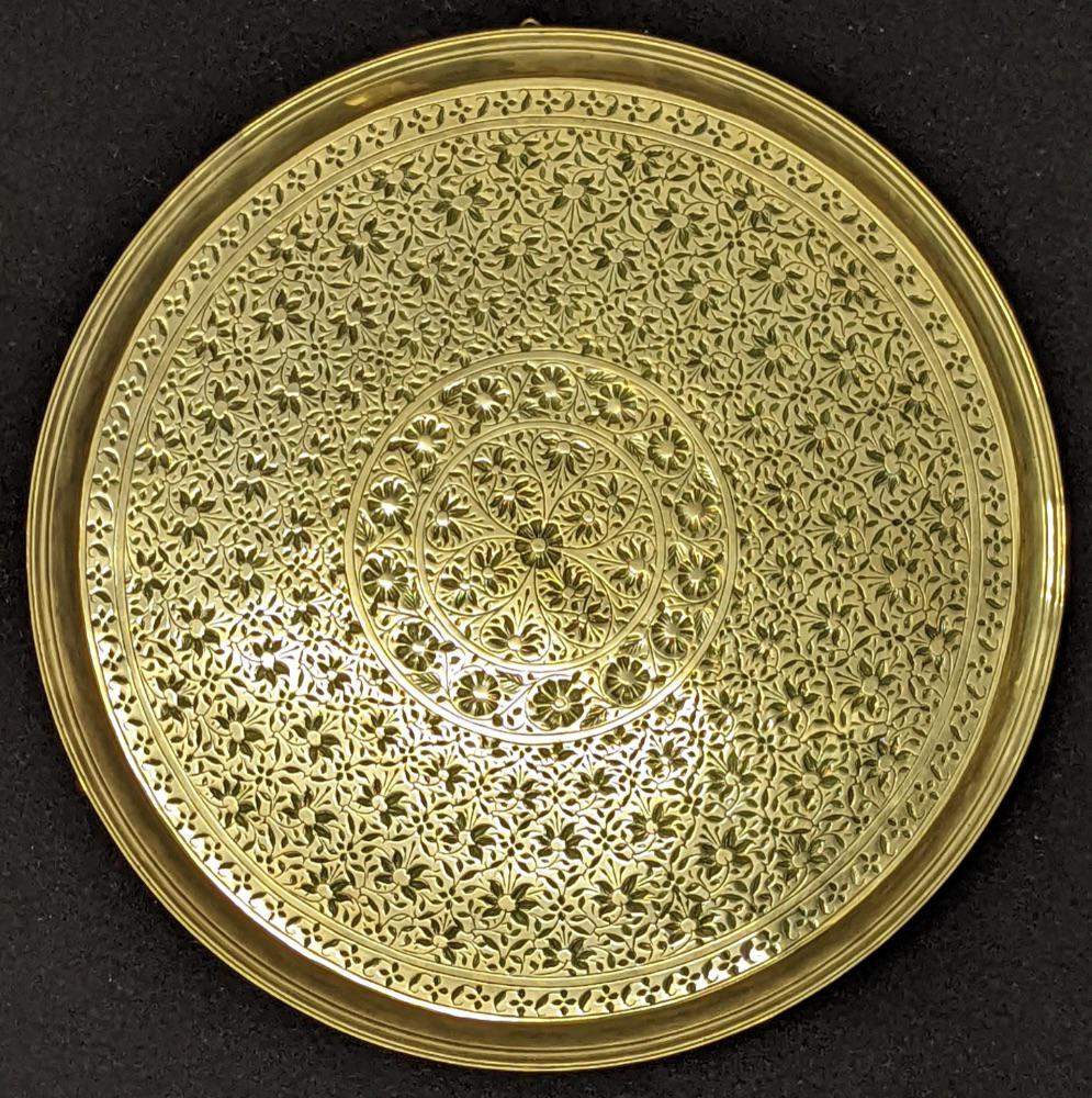 A fine 18th century Mughal Indian engraved brass tray, D.34cm (1 of 2)