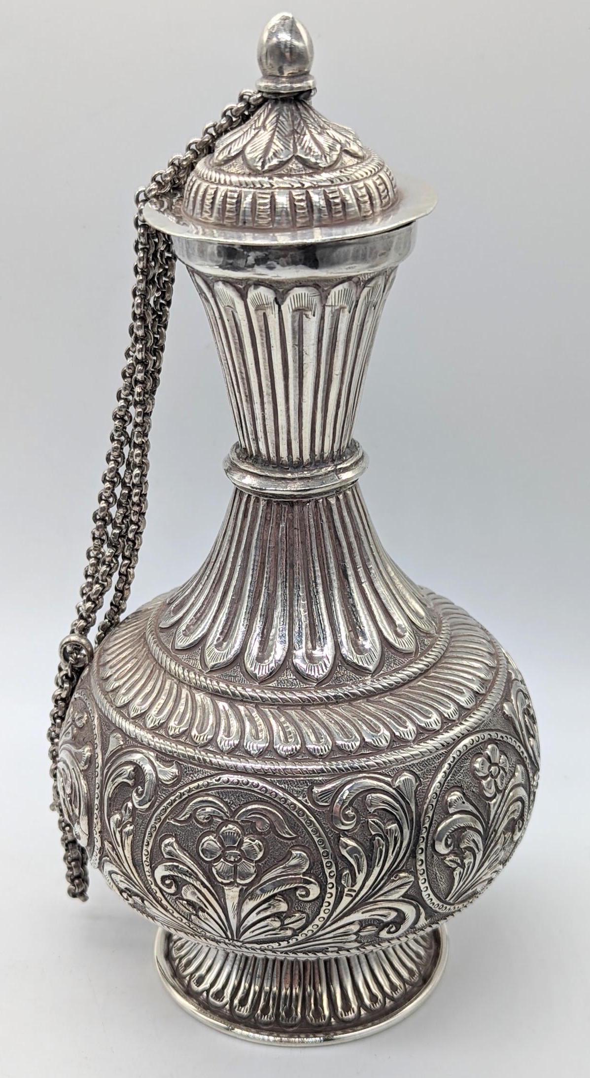 An Indian silver vase and cover, central embossed band of floral motifs, 465g, H.26cm (1 of 2)