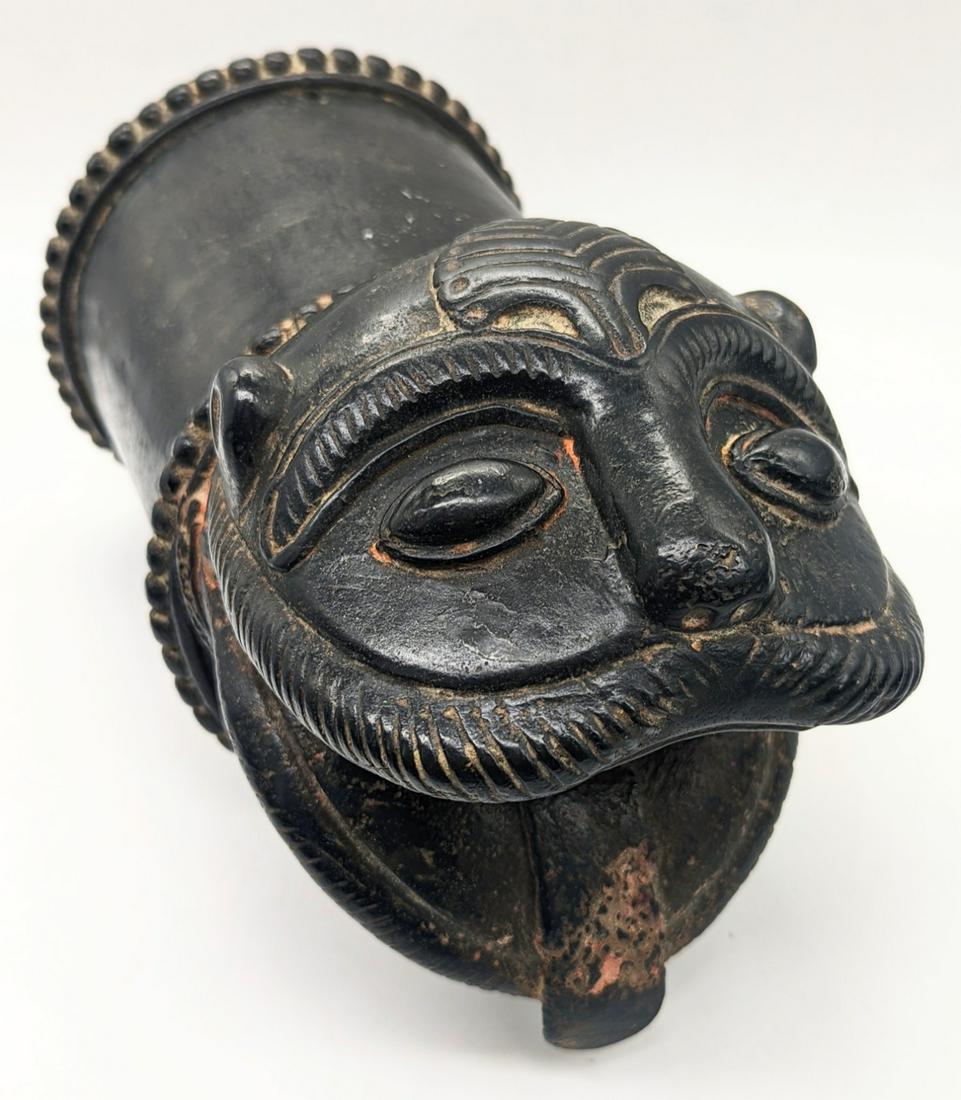 A fine 18th century South Indian bronze tigers head palanquin finial, remnants of pigment, H.22cm (1 of 2)
