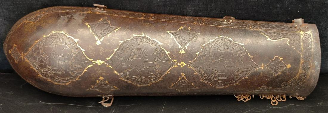 A 19th century Persian Qajar gold inlaid steel arm guard, L.34cm: A 19th century Persian Qajar gold inlaid steel arm guard, L.34cm