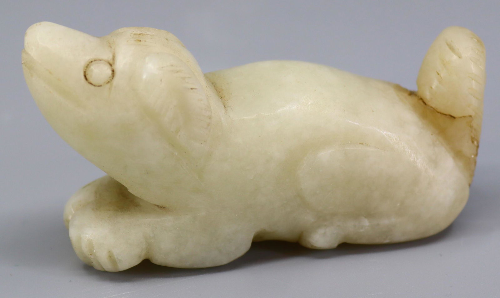 A white mutton fat jade carving of a mythical beast, H.4.4cm, L.8cm, W.2.5cm: A white mutton fat jade carving of a mythical beast, H.4.4cm, L.8cm, W.2.5cm