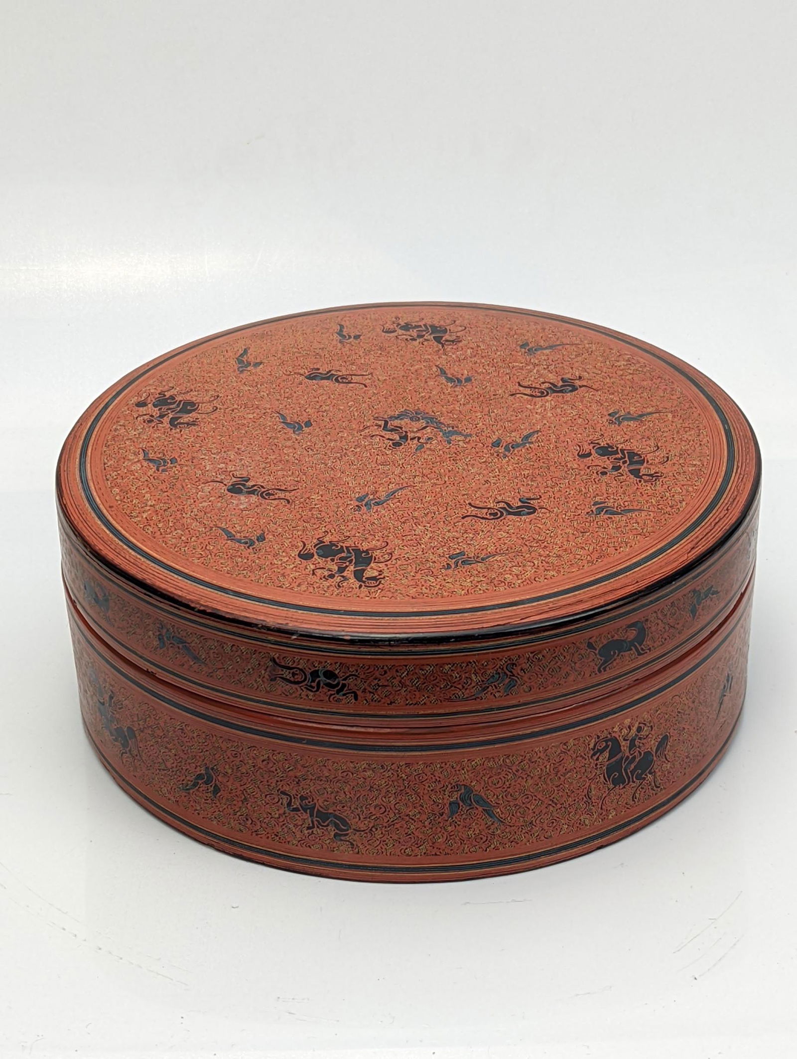 A 19th century flat Burmese red lacquered betel box (Kun-it), D.21cm (1 of 1)