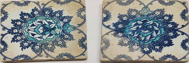 A pair of early 17th century Ottoman Turkish Iznik tiles depicting a central large lotus flower.