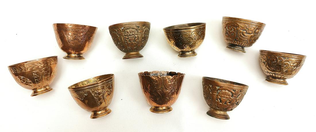 A collection of nine 18th century Ottoman Turkish gilt copper tombak cups, L.4cm W.5cm: A collection of nine 18th century Ottoman Turkish gilt copper tombak cups, L.4cm W.5cm