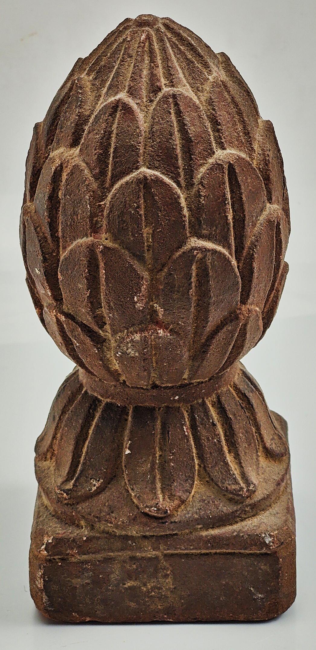 An 18th century Mughal Indian carved red stone carpet weight H.19cm W.8cm: An 18th century Mughal Indian carved red stone carpet weight H.19cm W.8cm