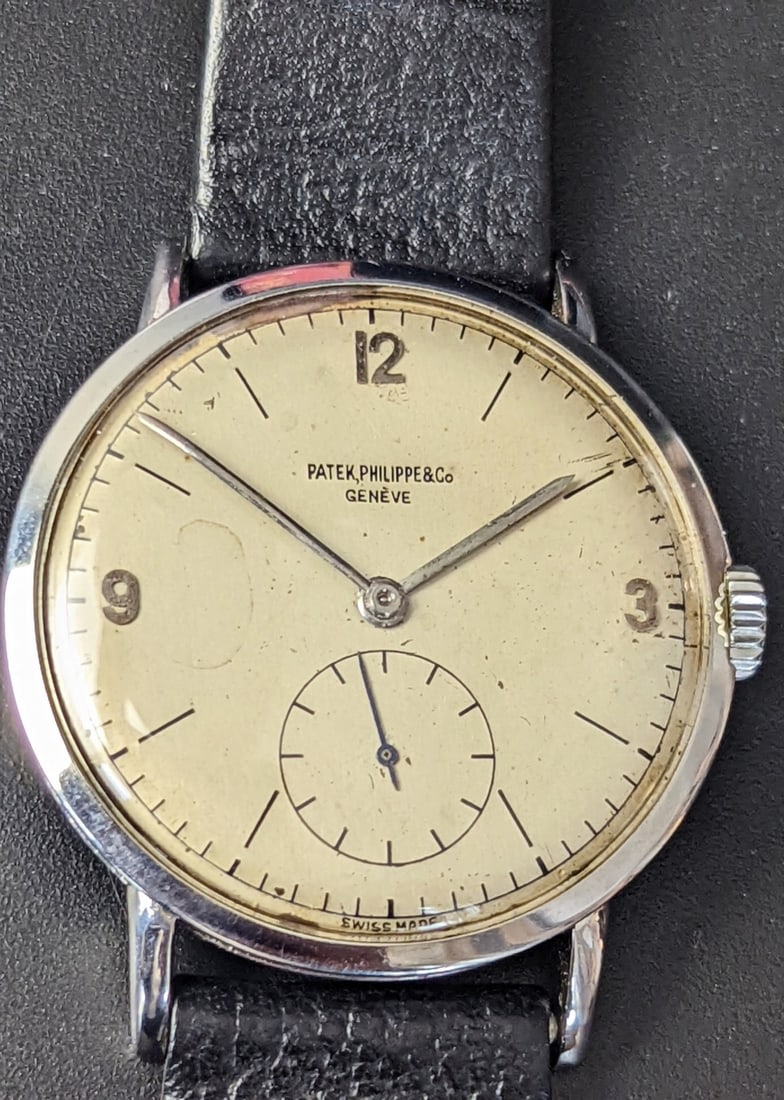 A Patek Philippe gents wristwatch, ref.1513, 1951, 35mm, stainless steel case, dial and movement: A Patek Philippe gents wristwatch, ref.1513, 1951, 35mm, stainless steel case, dial and movement signed, silvered dial with Arabic and baton hour markers, subsidiary dial for constant seconds with blu