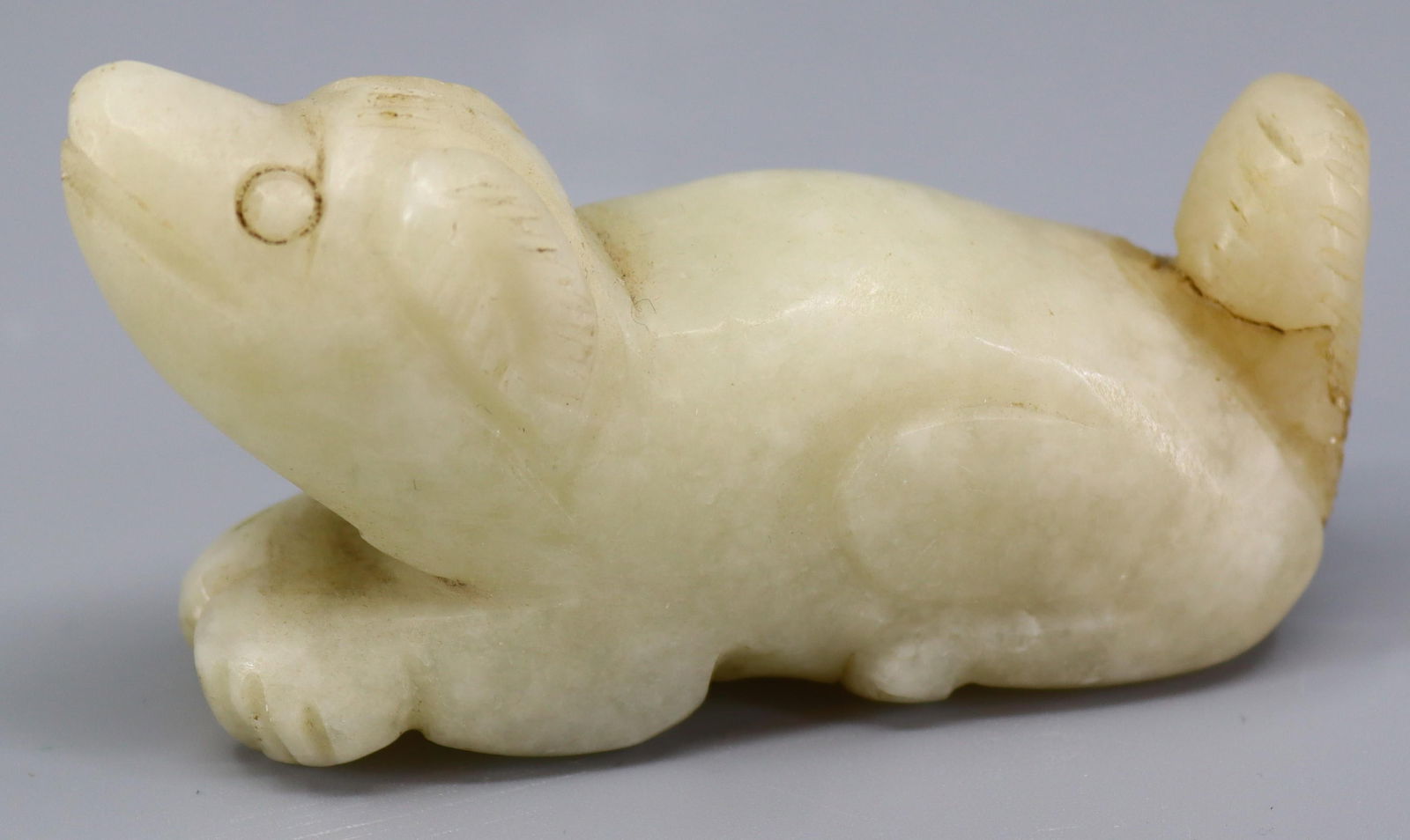 A white mutton fat jade carving of a mythical beast, H.4.4cm, L.8cm, W.2.5cm: A white mutton fat jade carving of a mythical beast, H.4.4cm, L.8cm, W.2.5cm