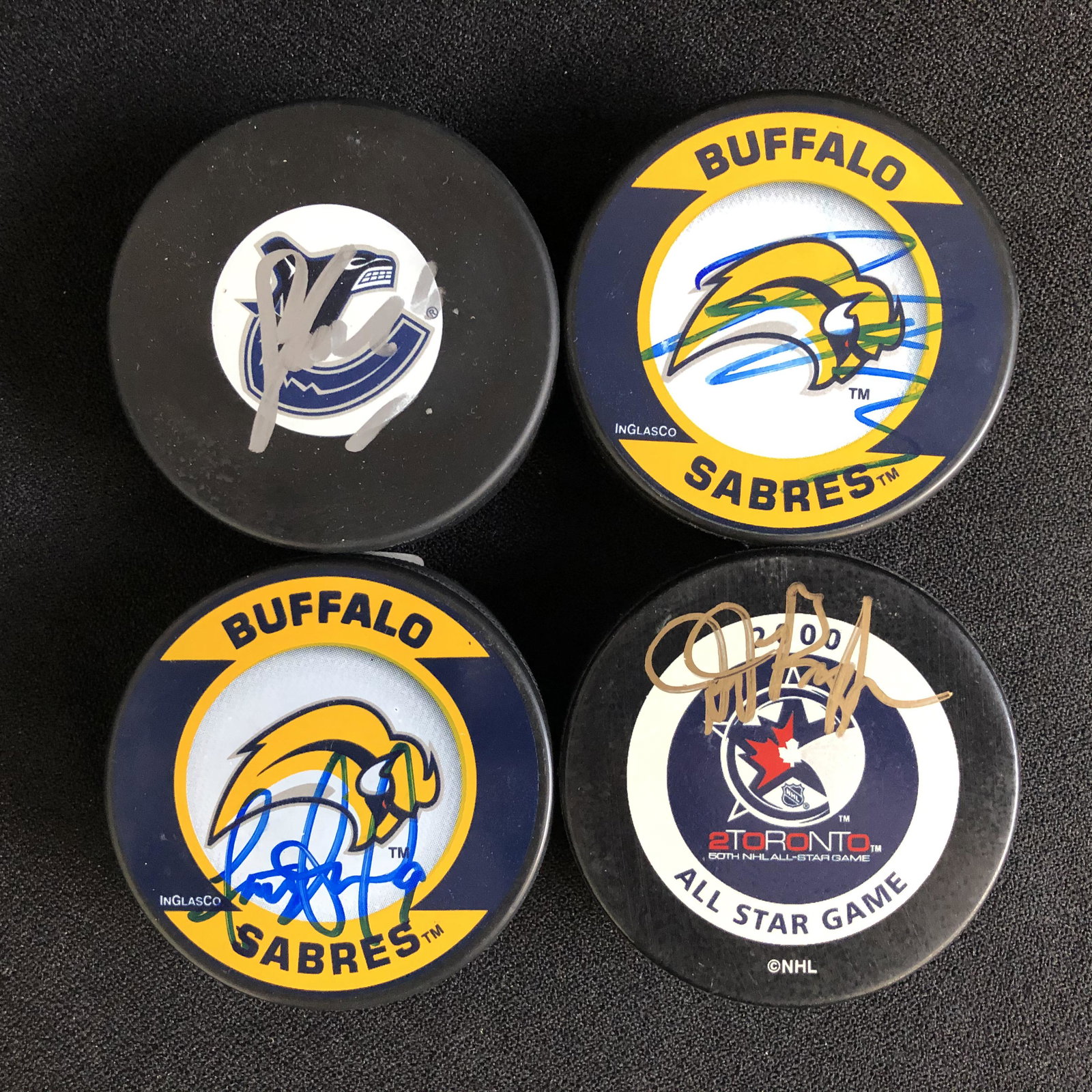 LOT OF 4 SIGNED HOCKEY PUCKS: LOT OF 4 SIGNED HOCKEY PUCKS