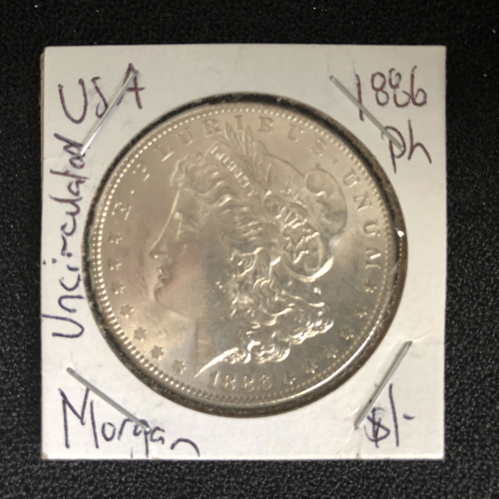 1886 USA MORGAN SILVER DOLLAR (PHILADELPHIA MINTED) (1 of 2)