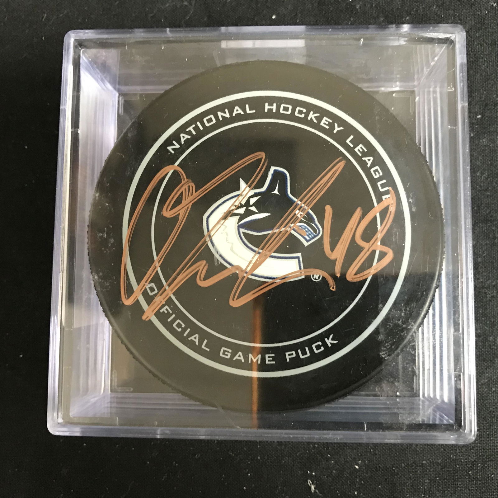 VANCOUVER CANUCKS OFFICIAL GAME PUCK SIGNED BY OLLI (1 of 2)