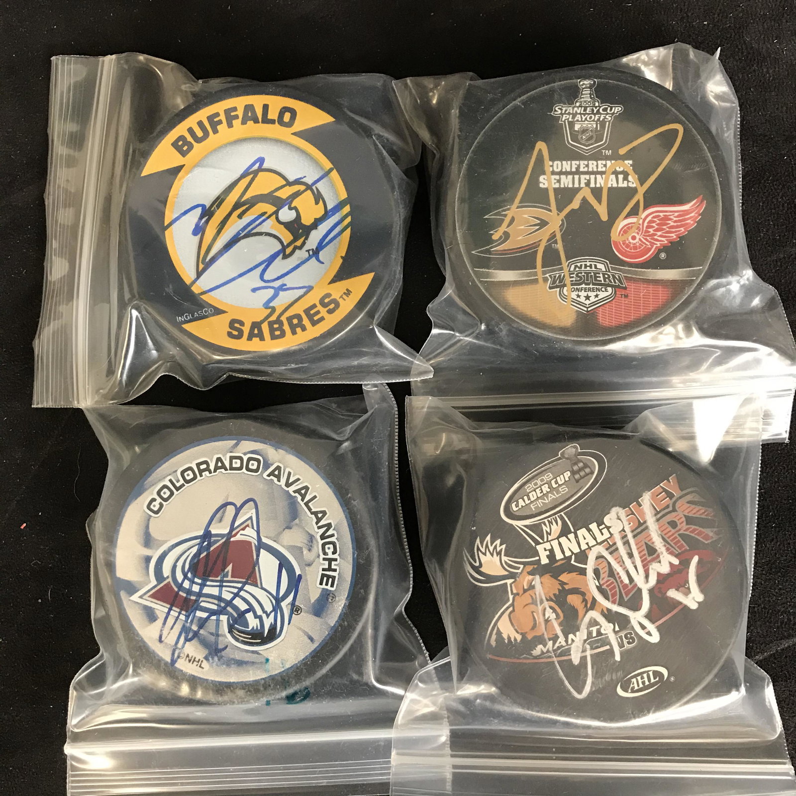 AUTOGRAPHED HOCKEY PUCK LOT (M. ELLIS, J.: AUTOGRAPHED HOCKEY PUCK LOT (M. ELLIS, J. ABDELKADER...)